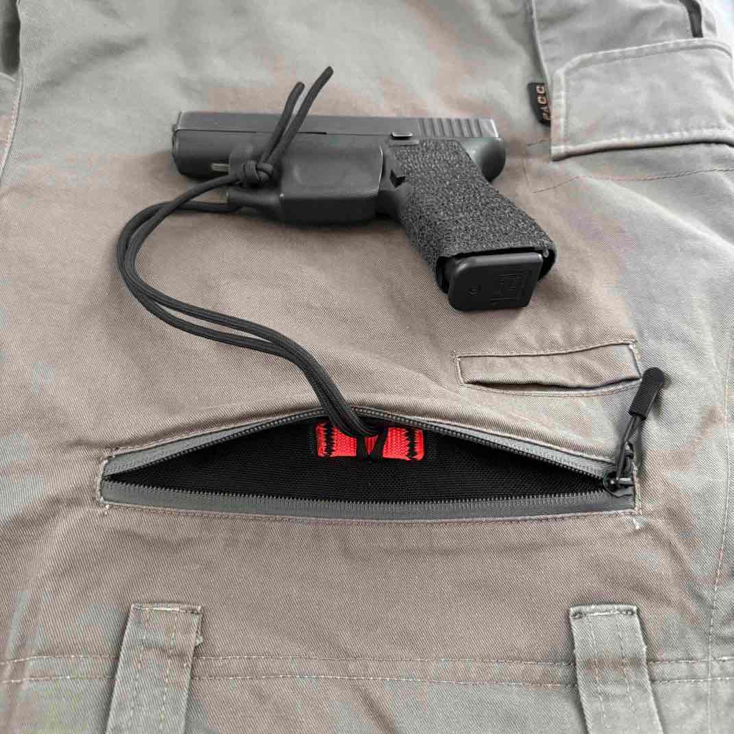 HDPE trigger guard with interior webbing tie-off